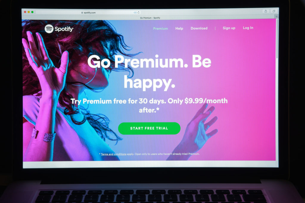 A computer screen advertising Spotify Premium subscription service.