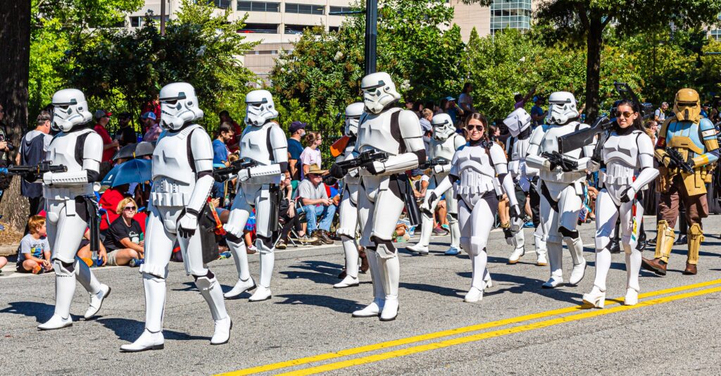 a group of clone troopers from the movie star wars walk on a street together in relation to the brand marketing of the star wars movie