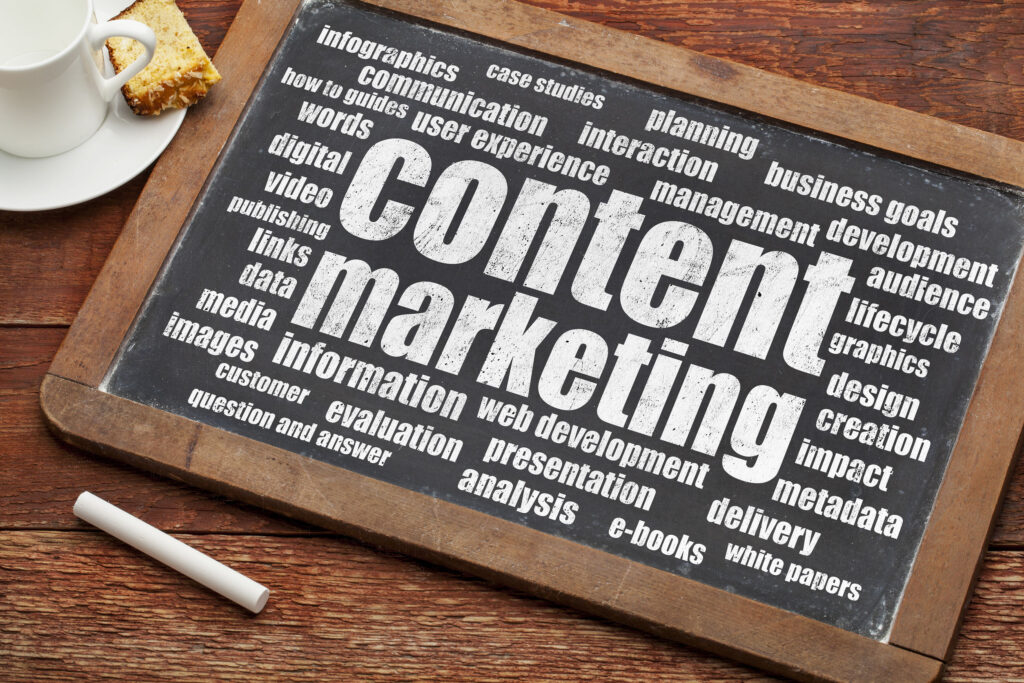 content marketing strategy word cloud on a digital tablet with a cup of coffee