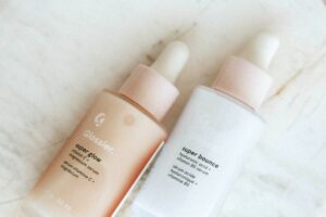 two products of the brand glossier